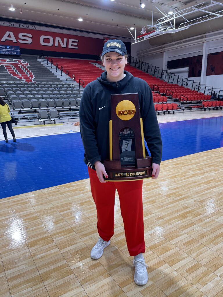 Coach Taylor Fosler with the NCAA national championship trophy